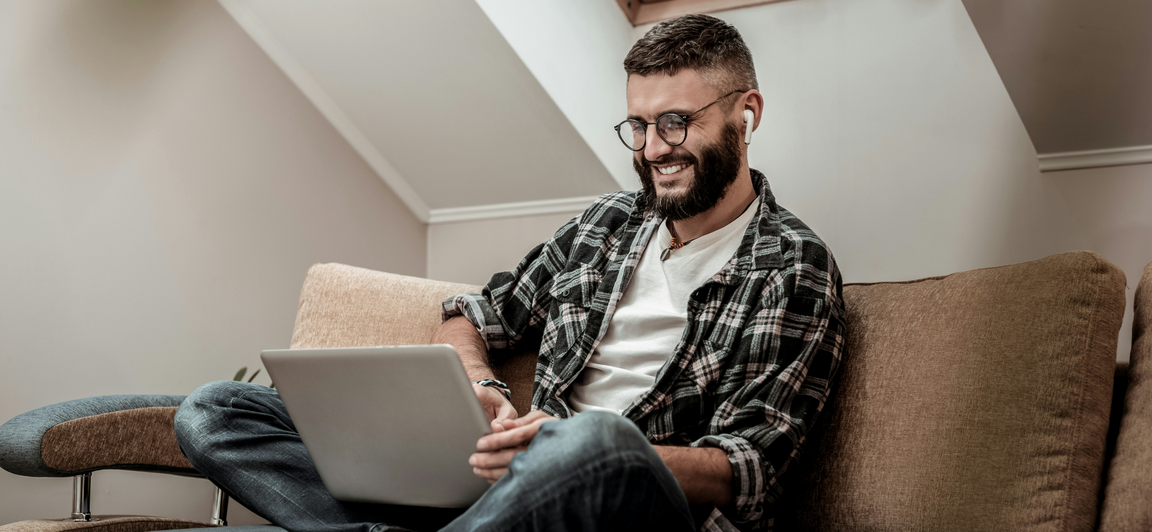 Man uses tablet to control home lighting & shading