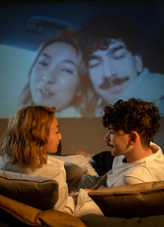 couple watching movie on home theater