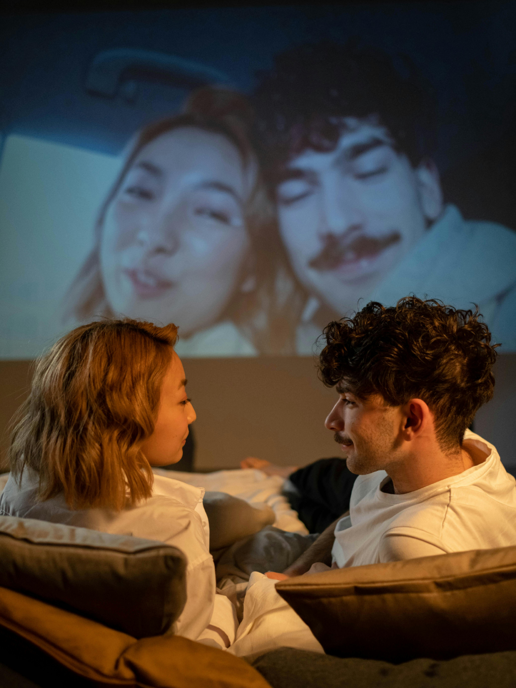 couple watching movie on home theater